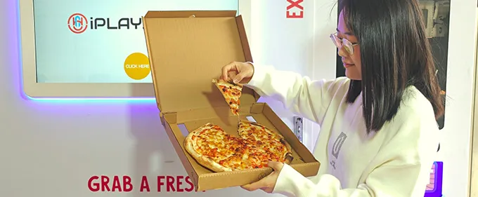 High-tech pizza making! A smart pizza machine dispenses pizzas automatically, delivering a surprisingly delicious taste